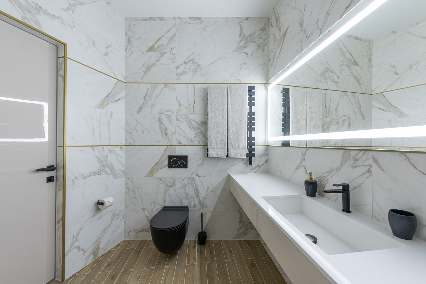 Interior of modern light bathroom with parquet floor and marble walls